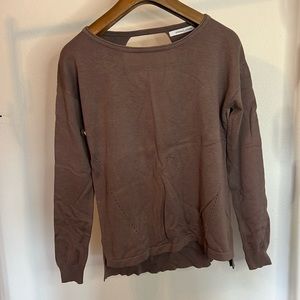 Light weight sweater with open back.